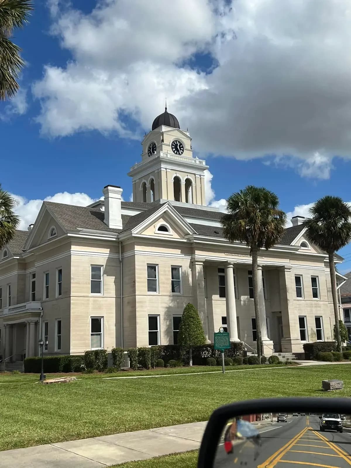 Second view of a clock-tower civic building with a light shingle roof